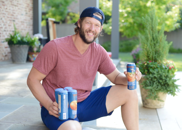 Clayton Kershaw holding Wicked Curve beer cans